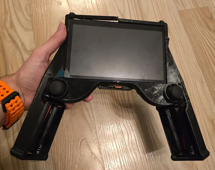 The controller held in one hand